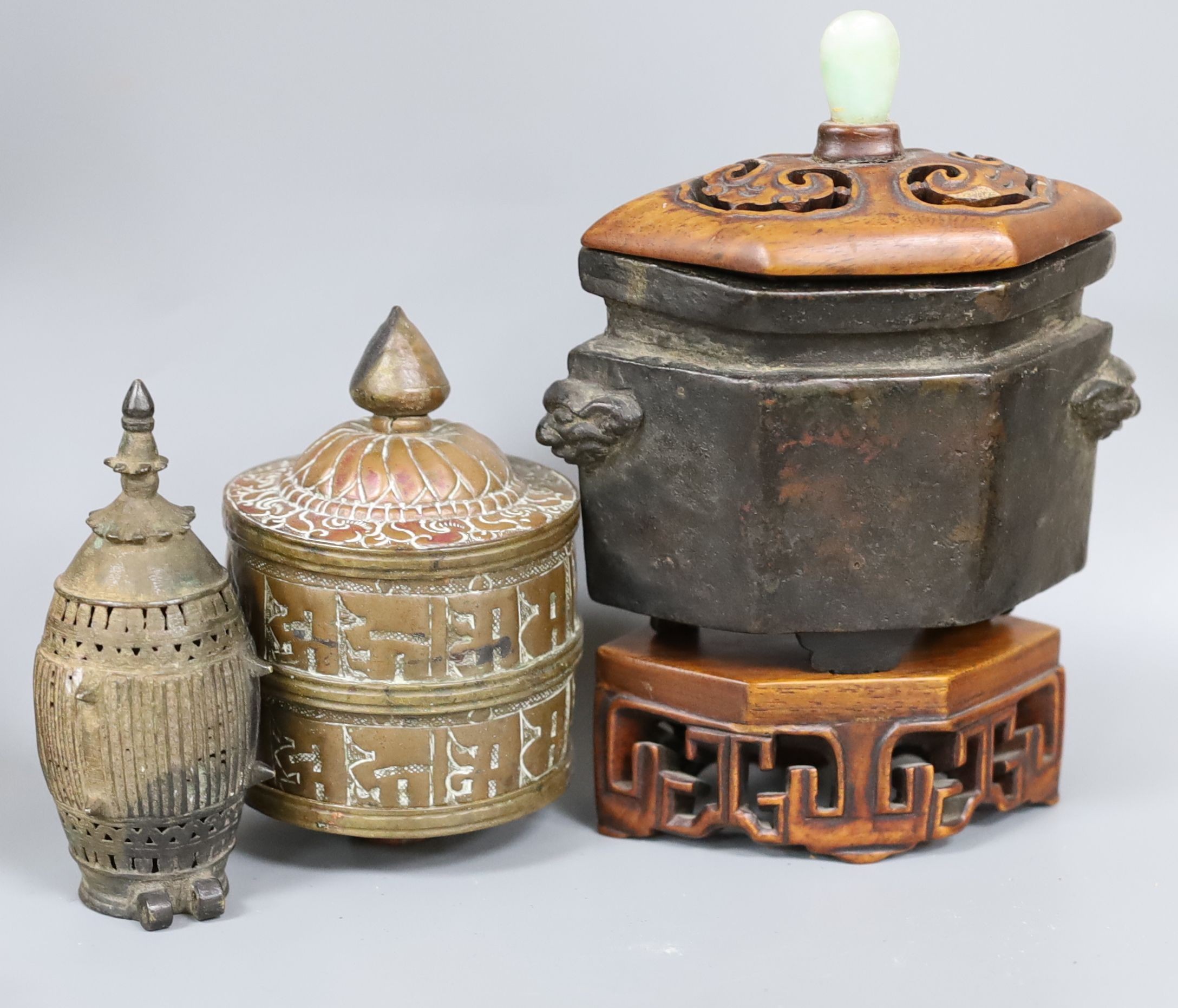 A group of Chinese and Himalayan bronze and metal vessels and objects